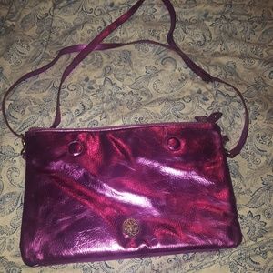 Metallic fuchsia and blue reversible clutch